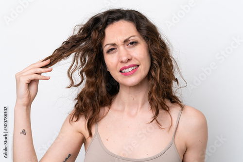 Young caucasian woman isolated on white background with tangled hair. Close up portrait