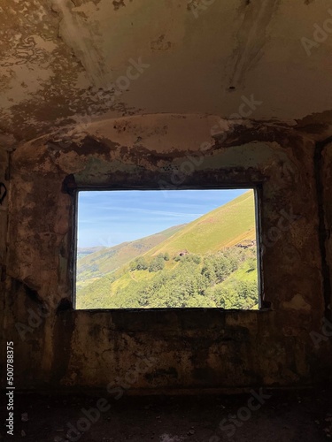 view of the spring valley through the abandoned building