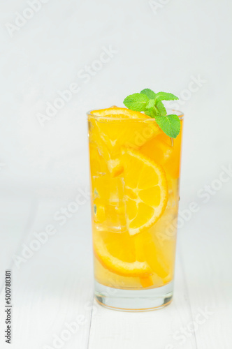 delicious refreshing cocktail drink with alcohol and orange with mint leaf