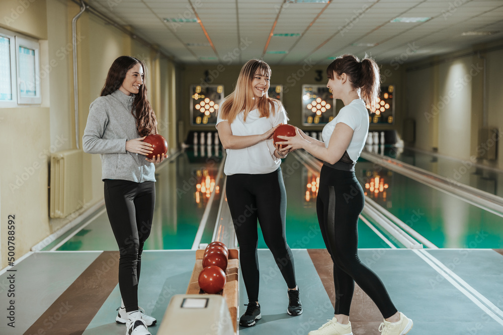 Three Female Friends Bowling Together Three Female Friends Bowling Together