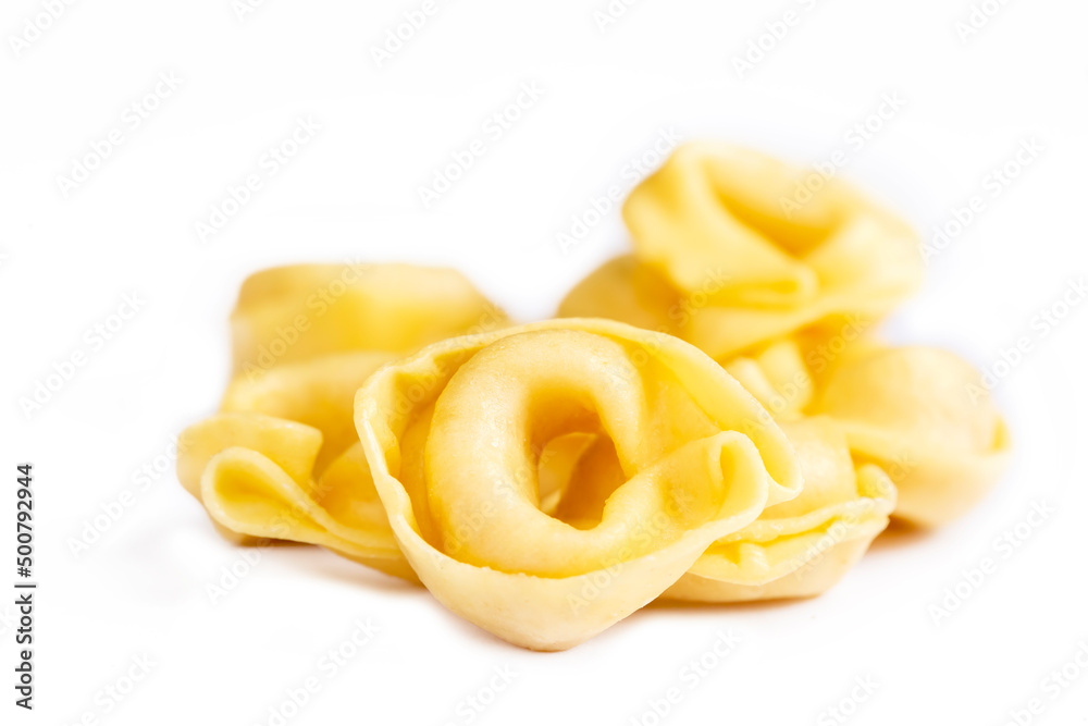 Raw fresh tortellini pasta isolated on white background