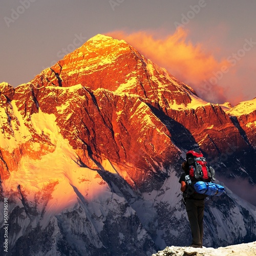 Evening mount Everest from Kongde village with tourist photo