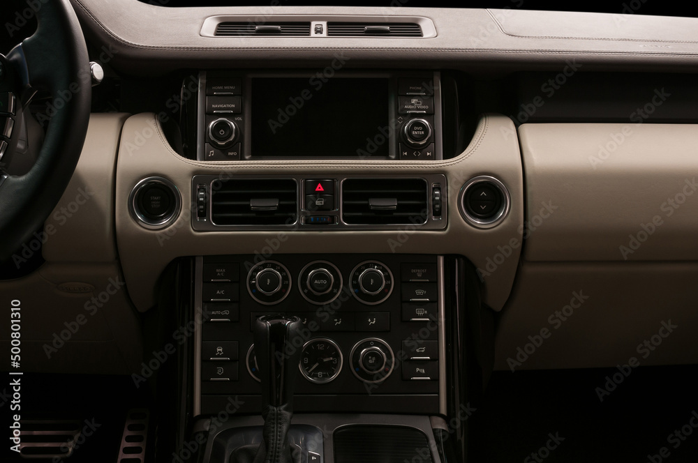 Luxury car interior. Multimedia screen and control buttons. Modern car inside. Luxury car interior. Multimedia screen and control buttons. Modern car inside.