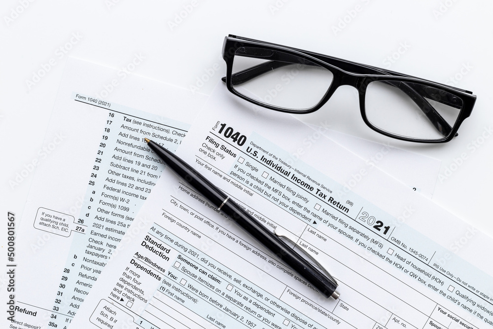 Pen on US individual tax form. Tax payment season Pen on US individual tax form. Tax payment season