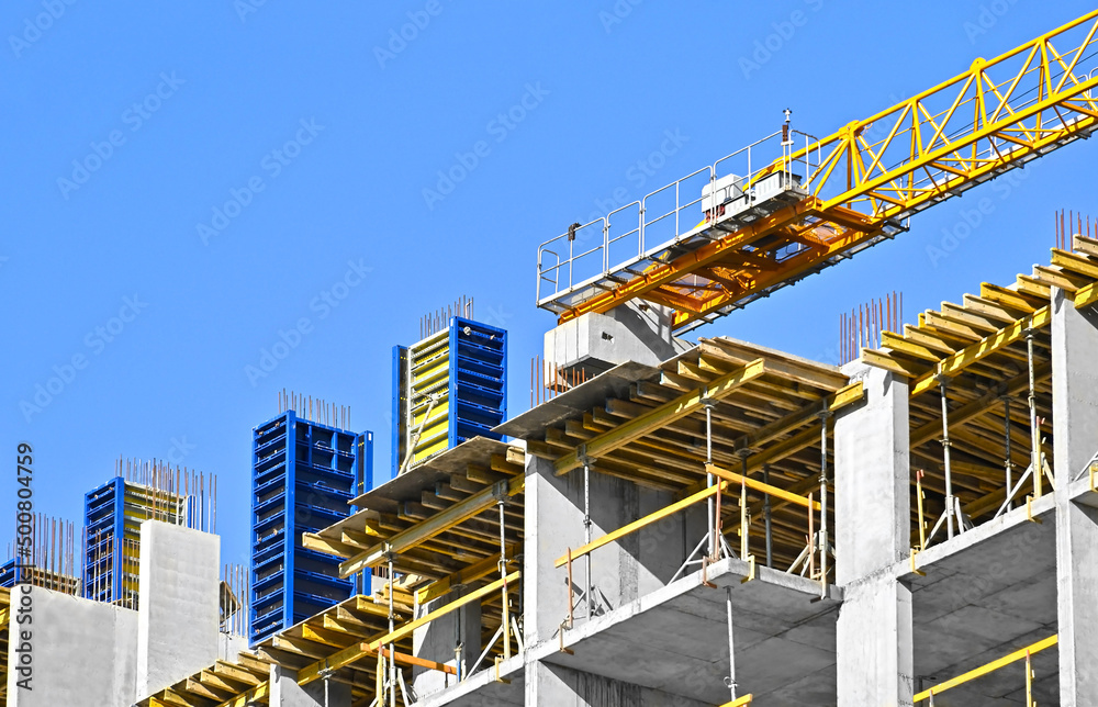 Fototapeta premium Crane and highrise construction site