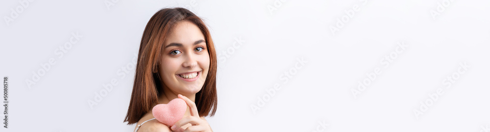 Beautiful smiling woman with clean skin, natural make-up and white teeth on a gray background Beautiful smiling woman with clean skin, natural make-up and white teeth on a gray background