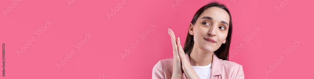 Portrait of beautiful young woman in pink jacket thinking isolated on red background Portrait of beautiful young woman in pink jacket thinking isolated on red background