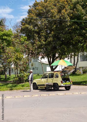 Man selling avocados on the street. Bogotá, Colombia.