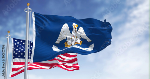 The Louisiana state flag waving along with the national flag of the United States of America