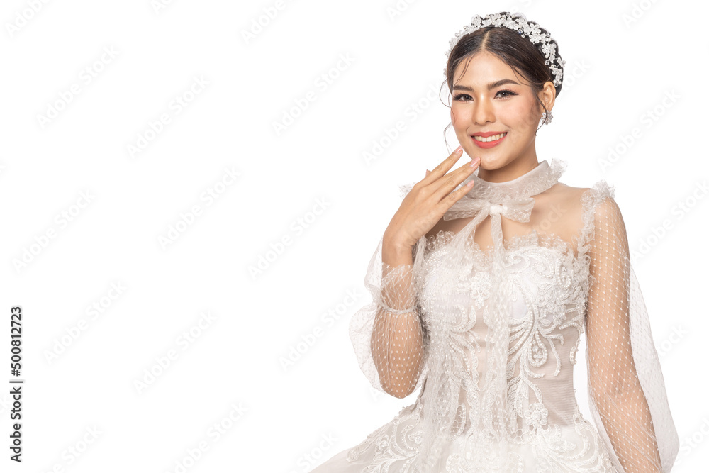 Portrait of smiling cheerful beautiful pretty asian fashion bride woman posing in white wedding dress on white background Portrait of smiling cheerful beautiful pretty asian fashion bride woman posing in white wedding dress on white background
