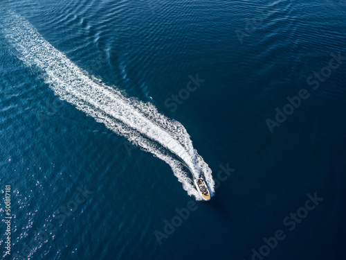 Aerial view of speedboat crossing Bodrum Harbor, Turkey © efired