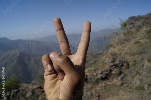 hand on the top of mountain
