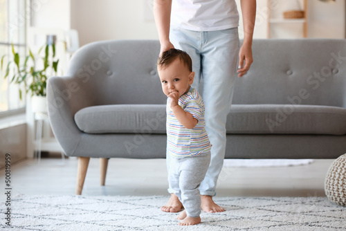 Little baby boy learning to...