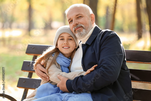 Little girl with her grandf...