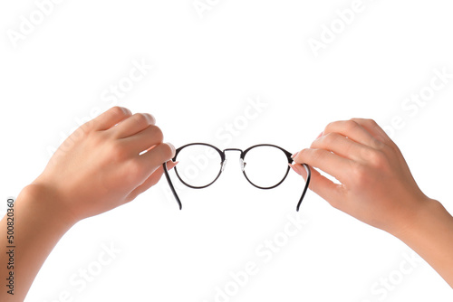 Female hands with new modern eyeglasses on white background