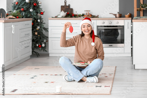 Happy young woman in Santa ...