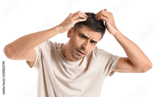 Worried young man with hair...