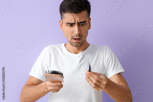 Worried young man with brus...