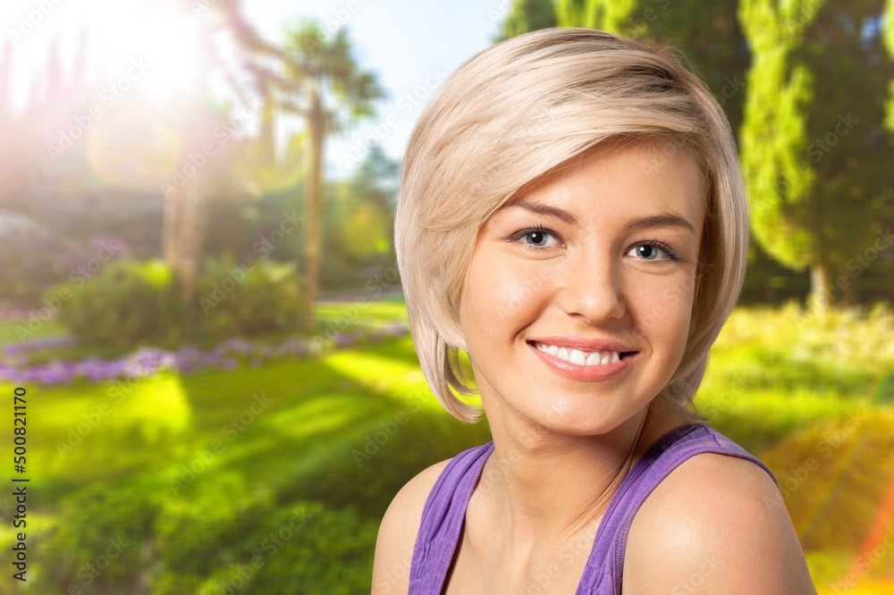 Young smiling woman walks at the park Young smiling woman walks at the park