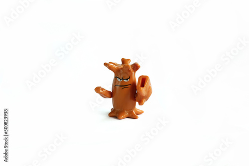 Close-Up Of Children's toy brown tree knight On White Background.