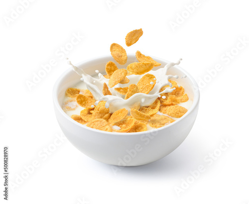 Fotografia Corn flakes with milk splash in white bowl isolated on white background