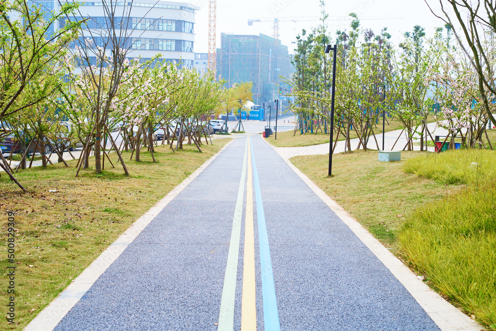 A straight road disappears at the end