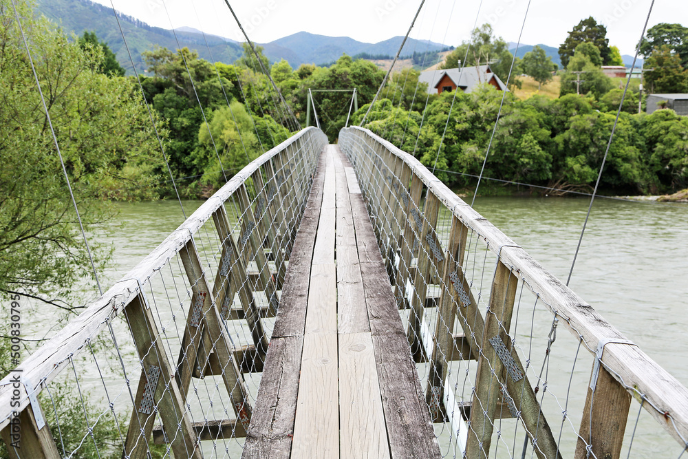 Walking on Pokororo swingbridge - New Zealand