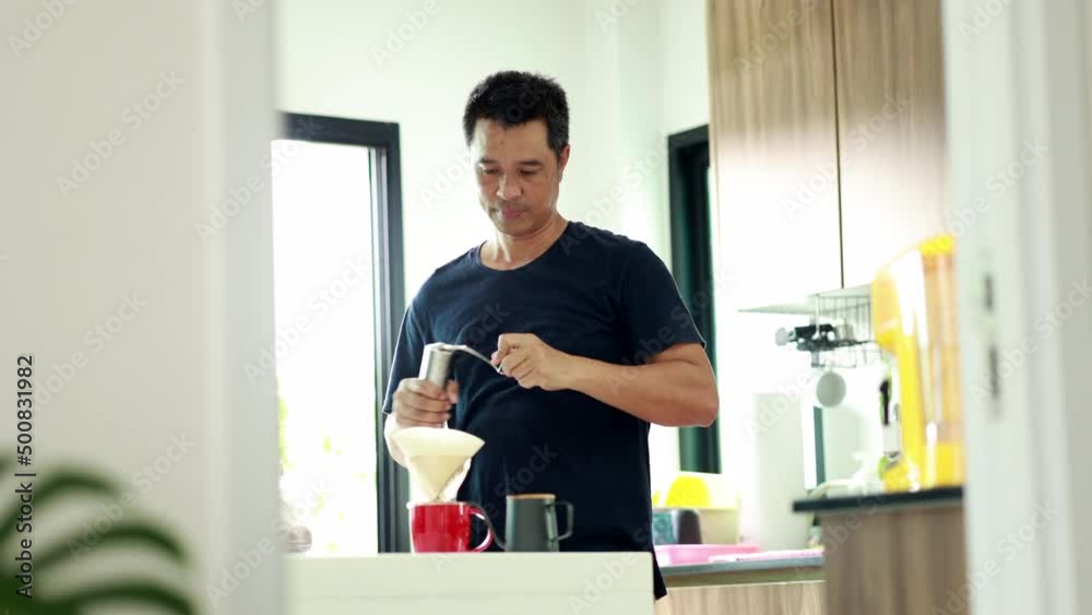 Asia man dripping coffee at home Asia man dripping coffee at home