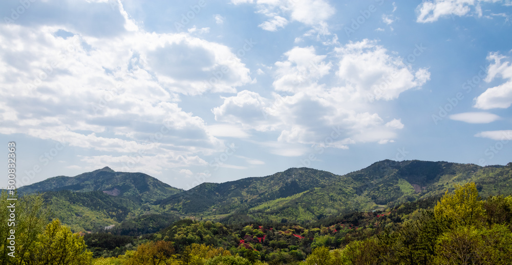 Nature landscape on a fine day. Mountains covered with blue sky, puffy clouds and green vegetation. Nature landscape on a fine day. Mountains covered with blue sky, puffy clouds and green vegetation.