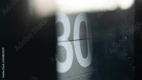 Numbers of minute on the clock changing continuously in time-lapse photo