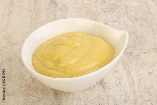 Organic mustard sauce in the bowl