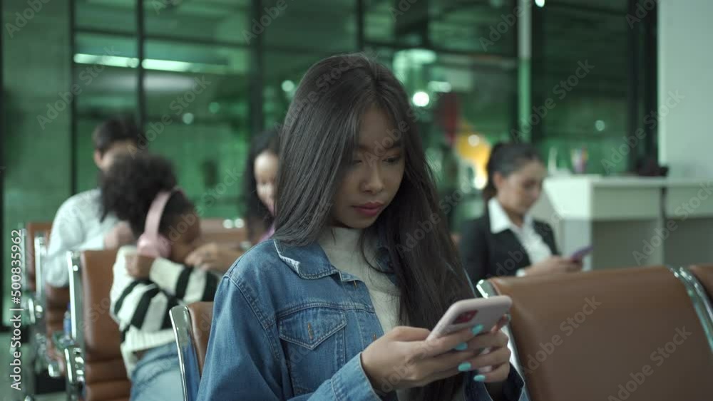Woman tourist making a video call to her friends and family before boarding. Woman tourist making a video call to her friends and family before boarding.