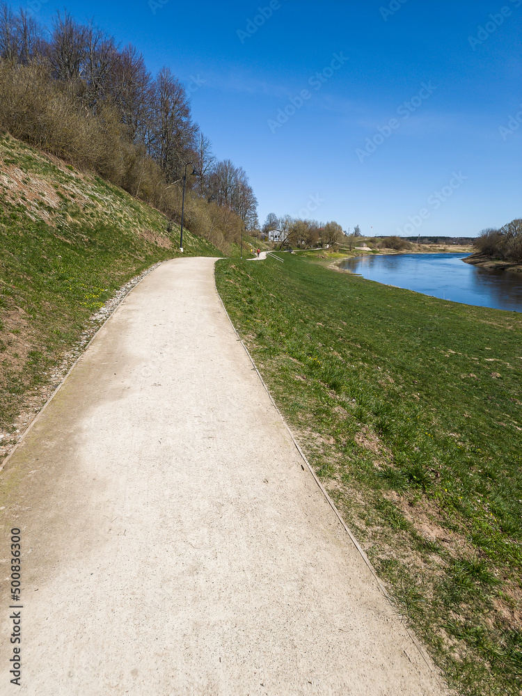 Walking trail by the Venta river on a sunny spring day, Skrunda, Latvia.