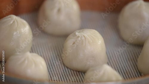 Steaming pork soup dumplings named Xiao long bao in Taiwan.