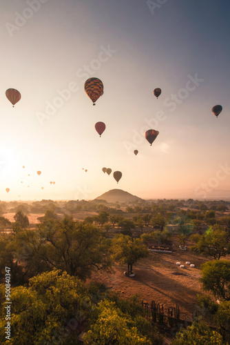 Vertical shot of the Teotihuacan Pyramids and trees from a sky balloon in Mexico