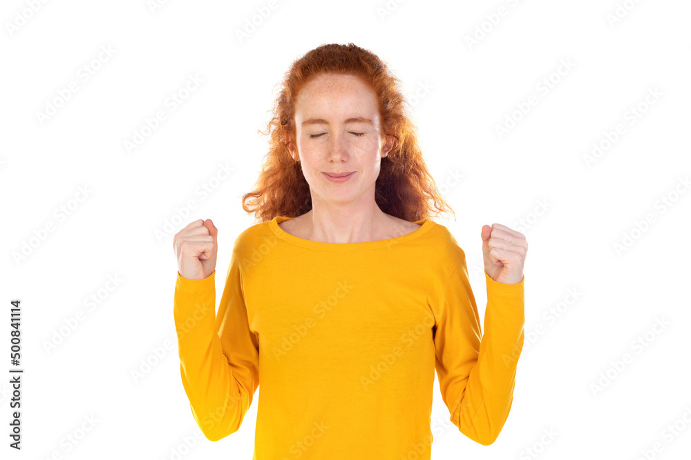 Teenager redhead girl over celebrating a victory Teenager redhead girl over celebrating a victory