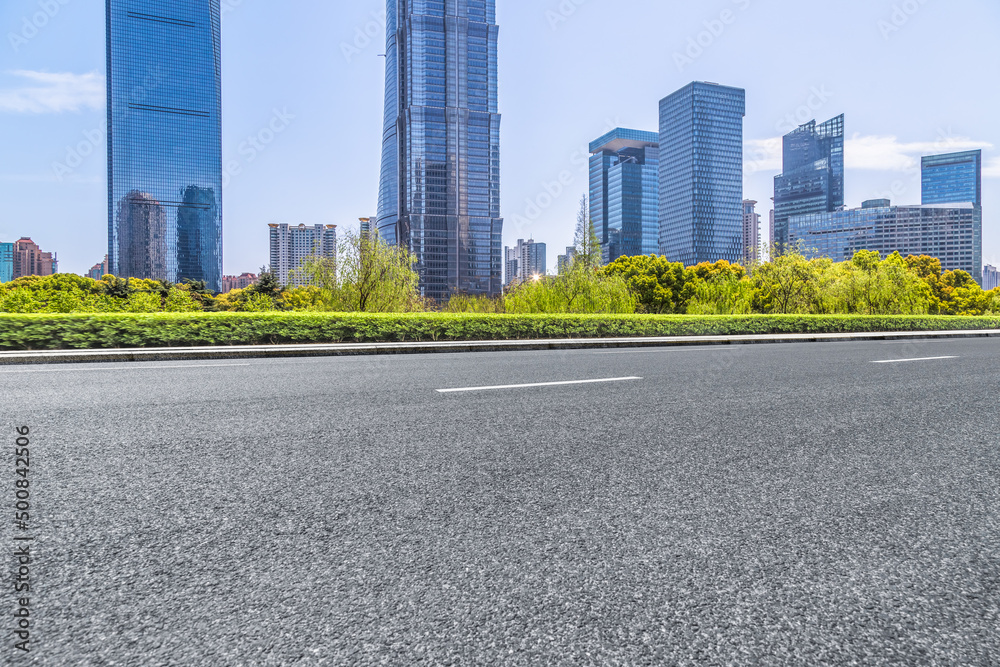 empty asphalt road with shanghai city skyline background in china