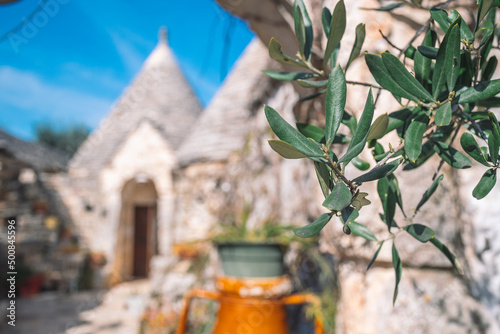Foto Group of beautiful Trulli or Trullo house, traditional Apulian dry stone hut wit
