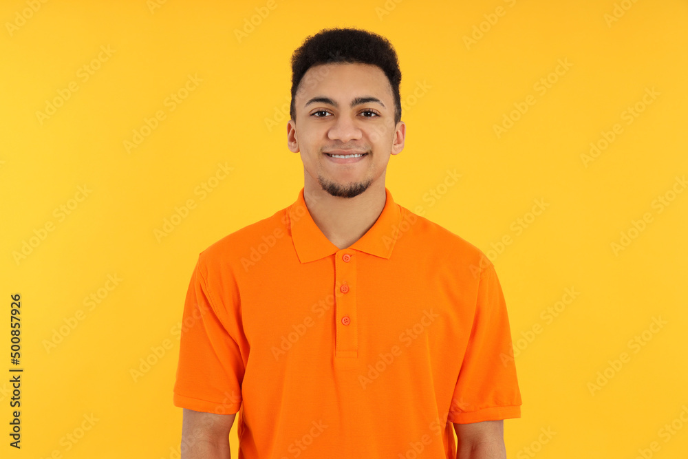 Concept of people with young man on yellow background Concept of people with young man on yellow background