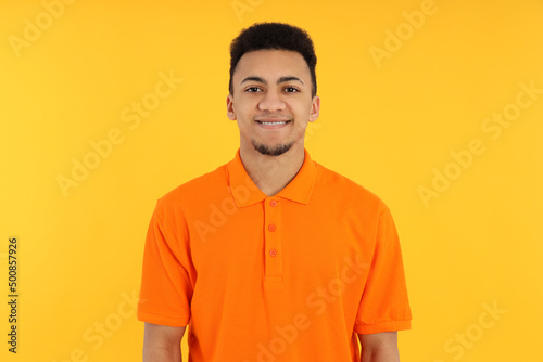 Concept of people with young man on yellow background
