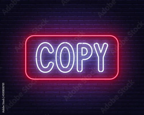 Neon sign Copy on brick wall background.