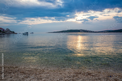 Boat sailing in Adriatic sea on sunset photo