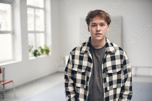 Young man wearing checked shirt