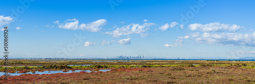 Panorama of undeveloped space with city skyline, in Point Cook, Melbourne, Australia.