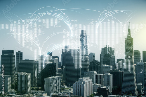 Double exposure of abstract digital world map hologram with connections on San Francisco city skyscrapers background, research and strategy concept