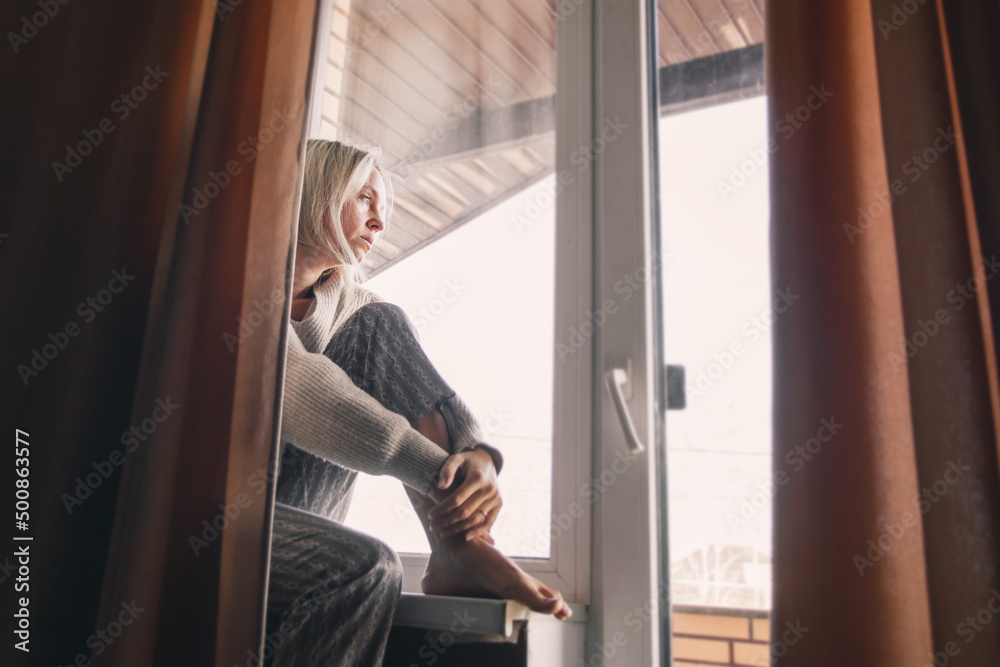 Sad pensive adult 40s woman at home Sad pensive adult 40s woman at home