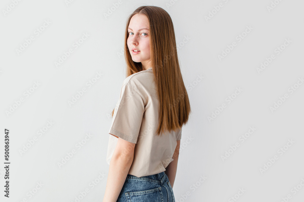 Portrait of young beautiful cute cheerful girl smiling over white background