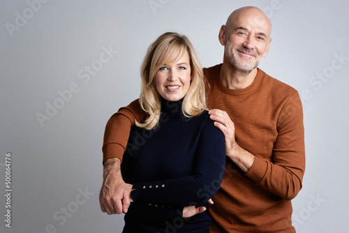 Happy mature couple studio portrait