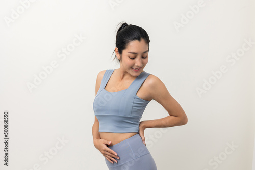 Happy Young beautiful asian woman with sportswear on isolated white background. Portrait sporty woman standing pose exercise workout in studio.