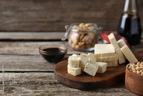 Different natural soy products on wooden table, space for text